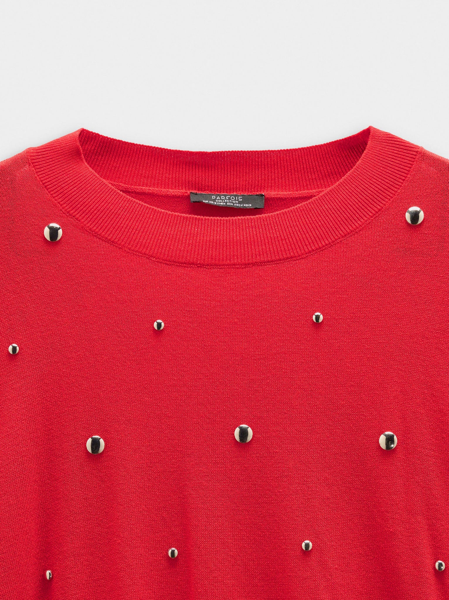 Jersey de punto con tachuelas